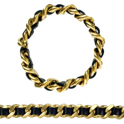 Lot 410 - A Chanel 'Barbie Collection' brushed 24ct gold-plated unisex curb link thong bracelet.