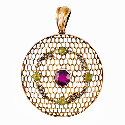 Lot 32 - An Edwardian Suffragette 9ct gold pendant set with a pyrope garnet, peridot and seed pearl.
