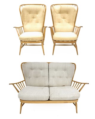 Lot 724 - An Ercol light elm and beech three-piece cottage suite.