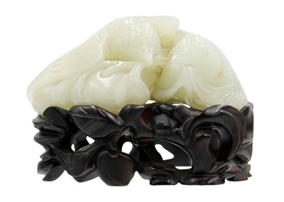 Lot 426 - A Chinese carved celadon jade group of quail, Qing Dynasty, 18th/19th century.