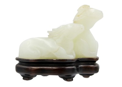 Lot 430 - A Chinese carved celadon jade group of deers, Qing Dynasty, 19th century.