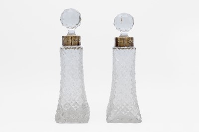 Lot 7 - A pair of Victorian silver-mounted cut glass decanters by Lee & Wigfull.