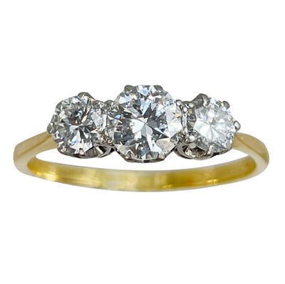 Lot 141 - A good 18ct diamond set three-stone ring.
