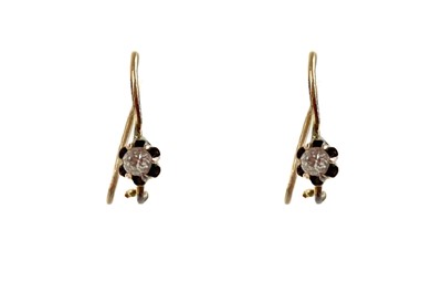 Lot 163 - A pair of gold diamond solitaire hoop earrings.