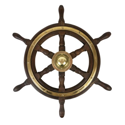 Lot 197 - A six spoke teak and brass bound yacht wheel by Simpson Lawrence.