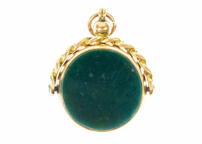 Lot 57 - A Victorian 9ct rose gold mounted carnelian and bloodstone set swivel fob.