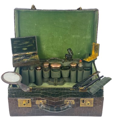 Lot 531 - A good Edwardian Harrods London crocodile leather vanity suitcase with 9ct bottles.
