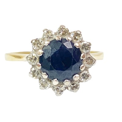 Lot 213 - An 18ct diamond and sapphire set cluster ring.