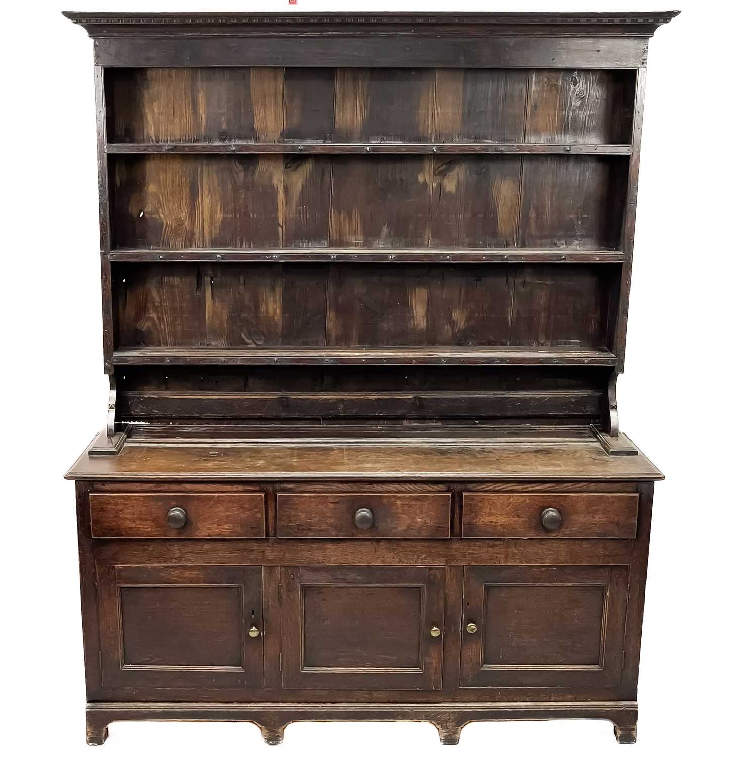 Lot 1018 - A George III oak dresser.