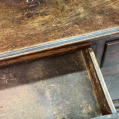 Lot 1018 - A George III oak dresser.