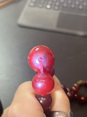 Lot 231 - A cherry amber bakelite necklace.