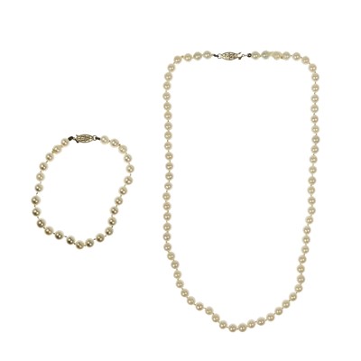 Lot 267 - A cultured pearl necklace and bracelet with 14ct clasps.