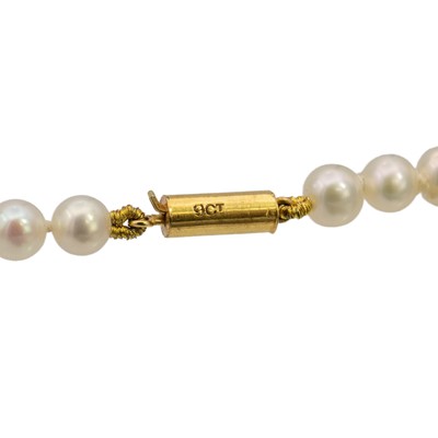 Lot 45 - Two cultured pearl necklaces, one with an amber drop.