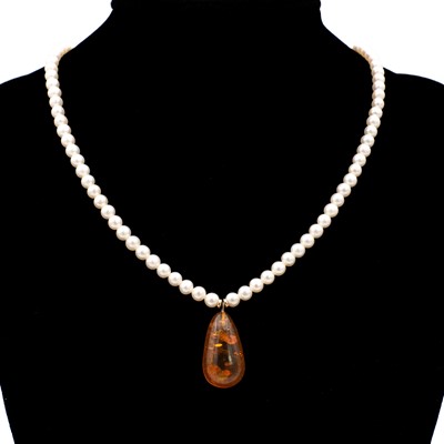 Lot 45 - Two cultured pearl necklaces, one with an amber drop.