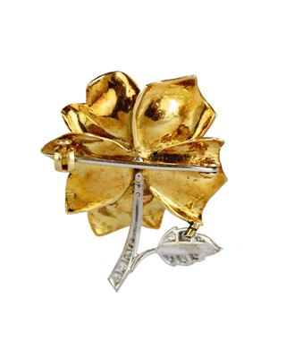 Lot 142 - A Ben Rosenfeld for Asprey 18ct white and yellow gold diamond and sapphire set flower brooch.