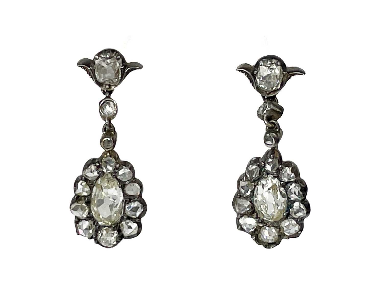 Lot 42 - A pair of 19th century silver diamond set pendant earrings.