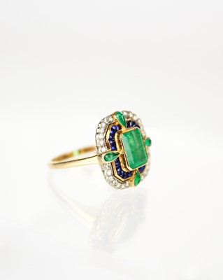Lot 286 - An attractive 18ct diamond, emerald and sapphire set dress ring.