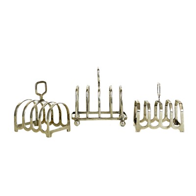 Lot 36 - Three silver hallmarked four section toast racks.