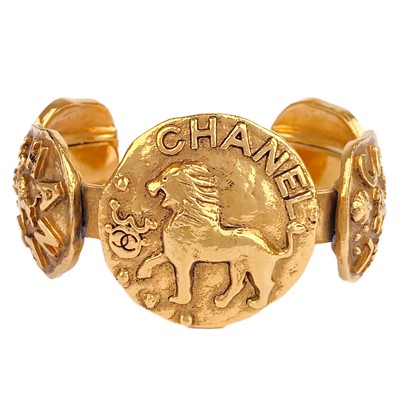 Lot 394 - A Chanel 24ct gold-plated five-medallion bangle, circa 1986.