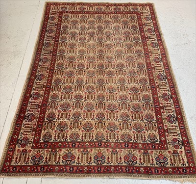 Lot 450 - A Tabriz carpet, North West Persia, the ivory...