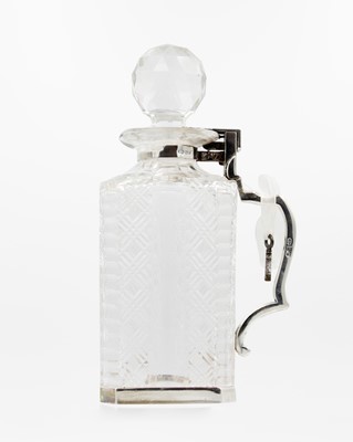 Lot 110 - An Edwardian Betjemann's patent silver mounted cut glass locking decanter.