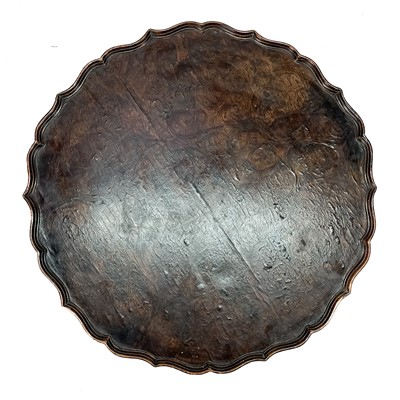 Lot 1089 - A George III style burr elm pie crust tripod wine table.