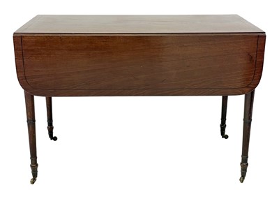 Lot 19 - A late George III figured mahogany and ebony strung Pembroke table.