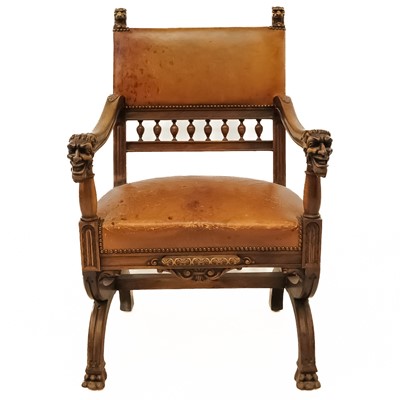 Lot 562 - A late 19th century Italian carved walnut and leather chair.