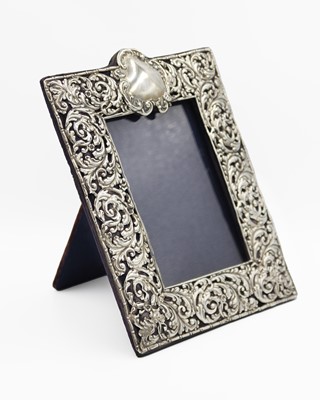 Lot 145 - An Edwardian silver-mounted rectangular photograph frame by Deakin & Francis.