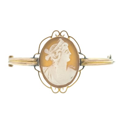 Lot 4 - A 9ct shell cameo set hinged bangle.