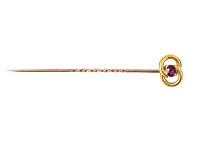 Lot 68 - A 15ct tie pin set with a small oval cut ruby.