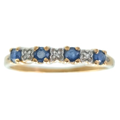 Lot 80 - A 9ct diamond and sapphire set seven stone half-hoop ring.