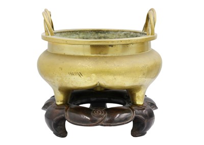 Lot 1049 - A large Chinese bronze twin-handled tripod censer on stand, Qing Dynasty.