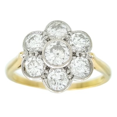 Lot 266 - An 18ct diamond flower head diamond set seven stone ring.