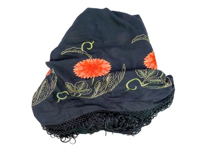 Lot 502 - An early 20th century silk embroidered piano shawl.
