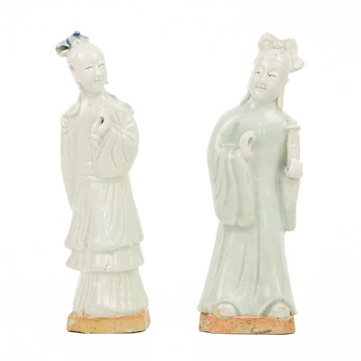 Lot 1044 - A pair of Chinese celadon figures of attendants, 19th century.
