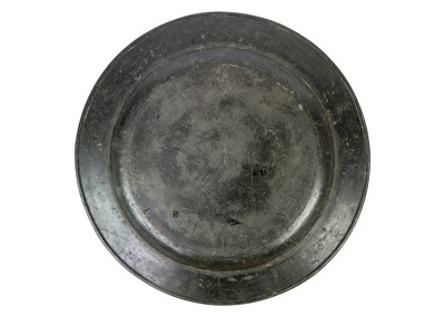 Lot 1016 - A large 18th century pewter charger.
