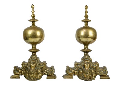 Lot 1017 - A pair of Dutch brass andirons.