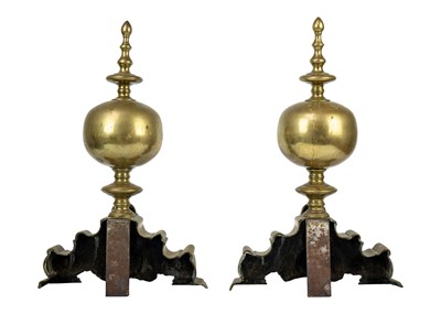 Lot 1017 - A pair of Dutch brass andirons.