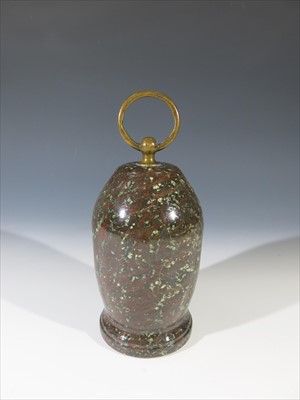 Lot 24 - A Cornish serpentine door stop with brass loop...