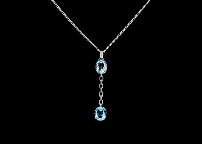 Lot 268 - An 18ct white gold blue topaz and diamond set pendant necklace.