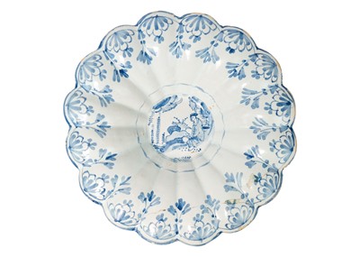 Lot 1025 - A probably South German faience blue and white lobed dish.