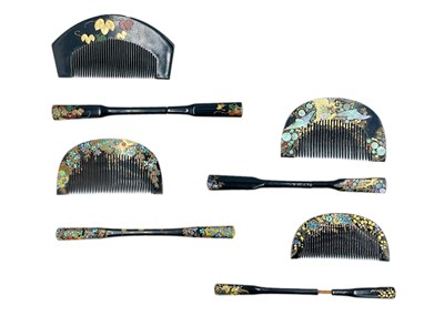 Lot 1028 - Four Japanese black lacquer, gilt and mother-of-pearl combs and kogai.