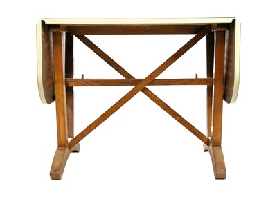 Lot 19 - A David Joel formica topped oak drop leaf table.