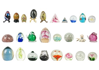 Lot 384 - A collection of glass paper weights.
