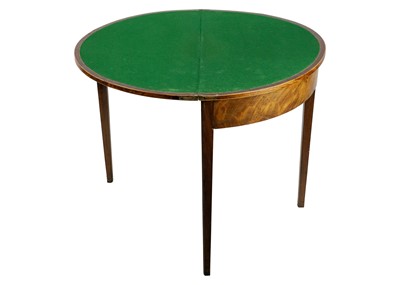 Lot 617 - A George III mahogany and boxwood strung fold top card table.