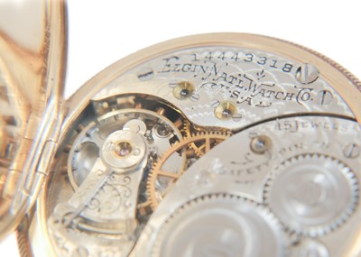 Lot 39 - An Elgin 14ct full hunter crown wind fob pocket watch, within a gilt tooled leather travel case.