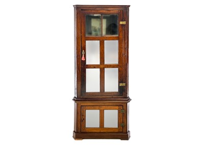 Lot 654 - A late George III mahogany standing corner cupboard.