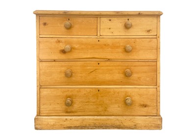 Lot 614 - A pine chest of two short and three long drawers.