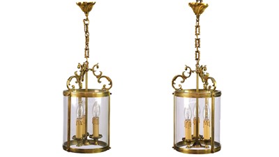 Lot 499 - A pair of circular glazed brass hall lanterns.